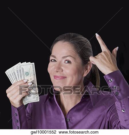 Woman holding currency notes View Large Photo Image Stock Image - Woman holding currency notes. Fotosearch