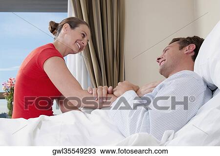 Woman in a hospital with her husband View Large Photo Image Stock Image - Woman in a hospital with her husband. Fotosearch