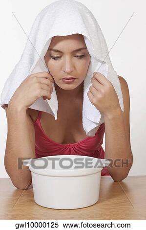 Woman inhaling steam View Large Photo Image Stock Photography - Woman inhaling steam. Fotosearch