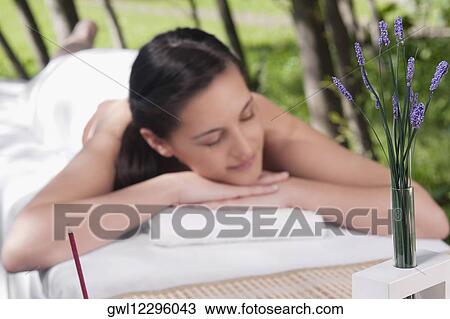 Stock Image - Woman lying on a massage table. Fotosearch