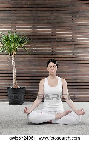 Woman meditating View Large Photo Image Stock Image - Woman meditating. Fotosearch