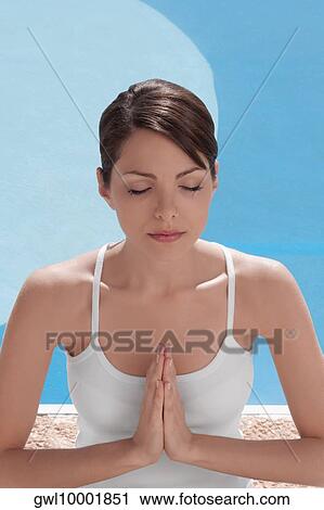 Woman practicing yoga at the poolside View Large Photo Image Stock Image - Woman practicing yoga at the poolside. Fotosearch
