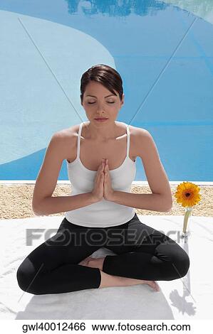 Woman practicing yoga at the poolside View Large Photo Image Stock Photograph - Woman practicing yoga at the poolside. Fotosearch