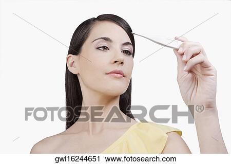 Woman reading a thermometer View Large Photo Image Stock Image - Woman reading a thermometer. Fotosearch
