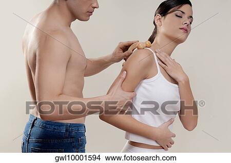Woman receiving a shoulder massage View Large Photo Image Picture - Woman receiving a shoulder massage. Fotosearch