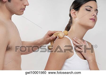 Woman receiving a shoulder massage View Large Photo Image Stock Image - Woman receiving a shoulder massage. Fotosearch