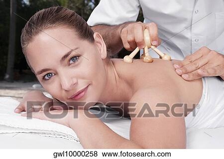 Woman receiving acupressure treatment View Large Photo Image Stock Photo - Woman receiving acupressure treatment. Fotosearch
