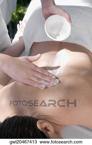 Woman receiving back massage from a massage therapist View Large Photo Image Stock Image - Woman receiving back massage from a massage therapist. Fotosearch