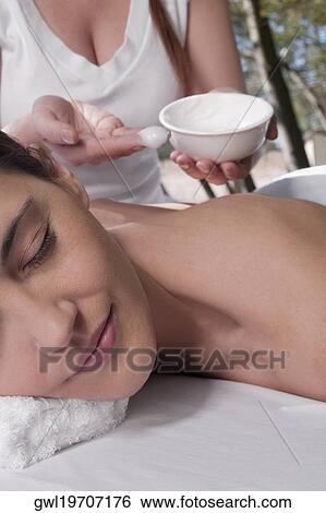Woman receiving back massage from a massage therapist View Large Photo Image Stock Photograph - Woman receiving back massage from a massage therapist. Fotosearch