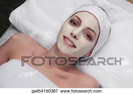 Woman receiving facial treatment View Large Photo Image Stock Photo - Woman receiving facial treatment. Fotosearch