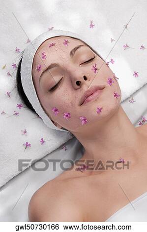 Woman receiving facial treatment View Large Photo Image Stock Photograph - Woman receiving facial treatment. Fotosearch