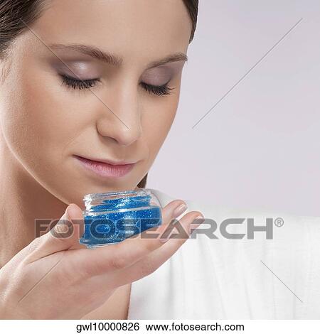 Woman smelling aroma gel View Large Photo Image Stock Photograph - Woman smelling aroma gel. Fotosearch