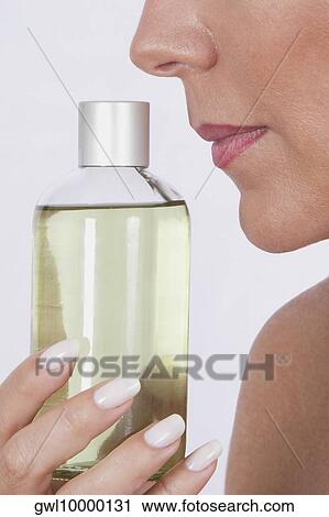 Woman smelling aromatherapy oil View Large Photo Image Stock Image - Woman smelling aromatherapy oil. Fotosearch