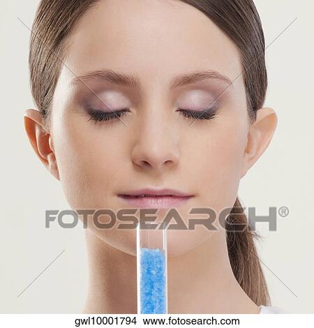 Woman smelling bath crystals View Large Photo Image Picture - Woman smelling bath crystals. Fotosearch