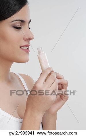 Woman smelling moisturizer cream View Large Photo Image Stock Image - Woman smelling moisturizer cream. Fotosearch