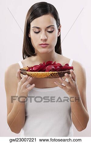 Woman smelling rose petals View Large Photo Image Stock Image - Woman smelling rose petals. Fotosearch