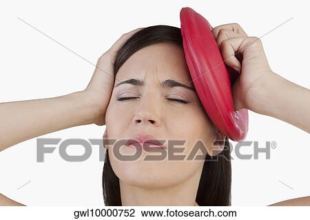 Woman suffering from a headache View Large Photo Image Stock Image - Woman suffering from a headache. Fotosearch