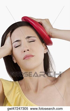 Woman suffering from a headache View Large Photo Image Stock Photography - Woman suffering from a headache. Fotosearch