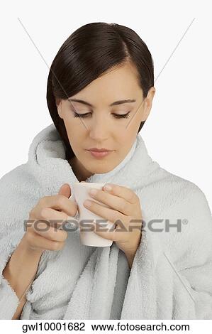 Woman taking hot drink View Large Photo Image Stock Image - Woman taking hot drink. Fotosearch