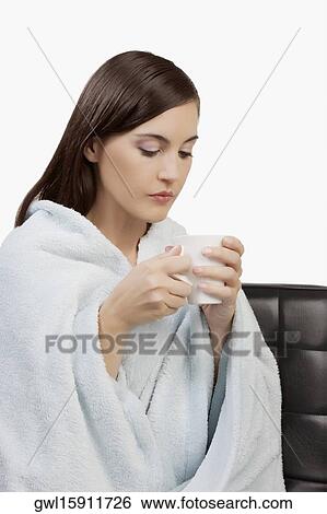 Woman taking hot drink View Large Photo Image Stock Photograph - Woman taking hot drink. Fotosearch