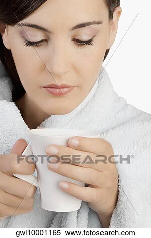 Woman taking hot drink View Large Photo Image Stock Photography - Woman taking hot drink. Fotosearch