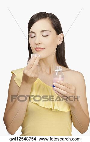 Woman taking medicine View Large Photo Image Picture - Woman taking medicine. Fotosearch