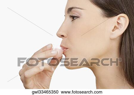 Woman taking medicine View Large Photo Image Stock Image - Woman taking medicine. Fotosearch