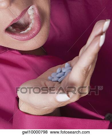 Woman taking medicine View Large Photo Image Stock Photo - Woman taking medicine. Fotosearch