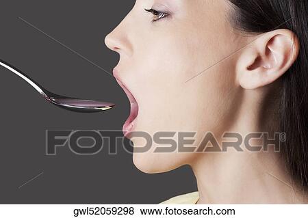 Woman taking medicine View Large Photo Image Stock Photo - Woman taking medicine. Fotosearch
