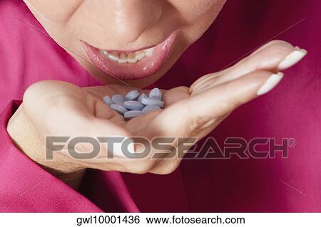 Woman taking medicine View Large Photo Image Stock Photograph - Woman taking medicine. Fotosearch