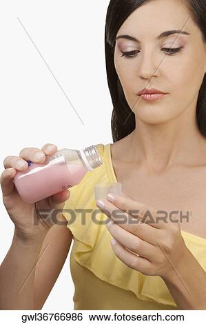 Woman taking medicine View Large Photo Image Stock Photograph - Woman taking medicine. Fotosearch
