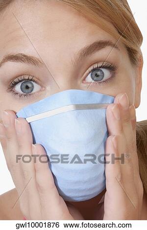 Woman wearing a flu mask View Large Photo Image Stock Photograph - Woman wearing a flu mask. Fotosearch
