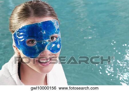 Woman wearing a mask at the poolside View Large Photo Image Stock Photograph - Woman wearing a mask at the poolside. Fotosearch