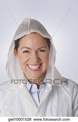 Woman wearing a raincoat View Large Photo Image Stock Photo - Woman wearing a raincoat. Fotosearch