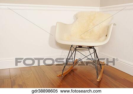 Stock Photography - Armchair in the corner of a room. Fotosearch