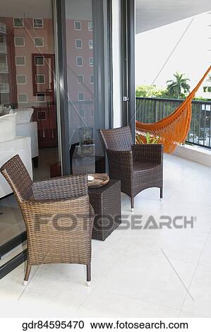 Armchairs at the balcony of a house View Large Photo Image Stock Image - Armchairs at the balcony of a house. Fotosearch
