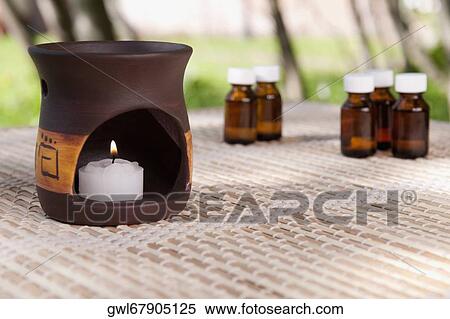 Aromatherapy burner with aromatherapy oil bottles View Large Photo Image Stock Photography - Aromatherapy burner with aromatherapy oil bottles. Fotosearch