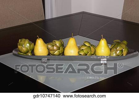 Artificial fruits on a tray on a table View Large Photo Image Stock Image - Artificial fruits on a tray on a table. Fotosearch