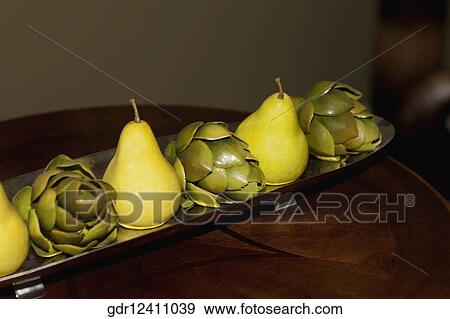 Artificial fruits on a tray on a table View Large Photo Image Stock Photo - Artificial fruits on a tray on a table. Fotosearch