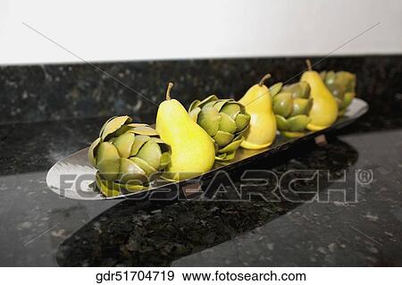 Artificial fruits on a tray on a table View Large Photo Image Stock Photo - Artificial fruits on a tray on a table. Fotosearch