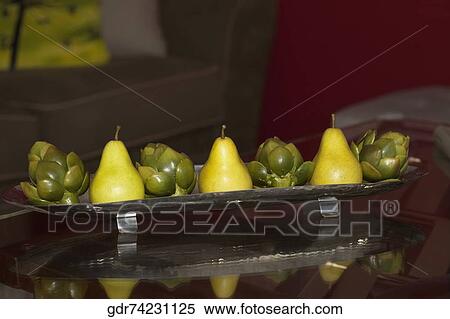 Artificial fruits on a tray on a table View Large Photo Image Stock Photography - Artificial fruits on a tray on a table. Fotosearch