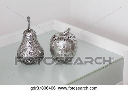 Artificial pear and an apple on a table View Large Photo Image Stock Photograph - Artificial pear and an apple on a table. Fotosearch