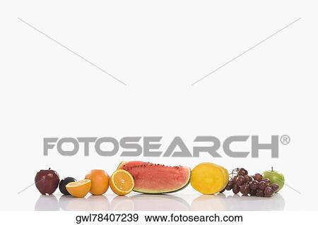 Stock Photo - Assorted fresh fruits in a row. Fotosearch