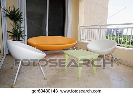Balcony of a house with furniture View Large Photo Image Stock Image - Balcony of a house with furniture. Fotosearch