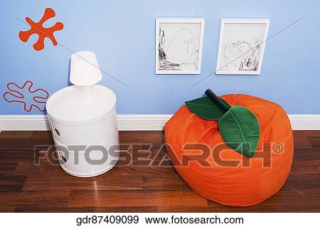 Bean bag with a lamp on a sideboard View Large Photo Image Stock Photo - Bean bag with a lamp on a sideboard. Fotosearch