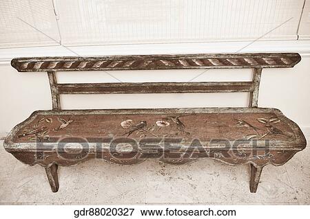 Stock Photo - Bench in front of a window. Fotosearch