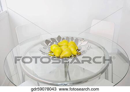 Bowl of artificial pears on a dining table View Large Photo Image Stock Image - Bowl of artificial pears on a dining table. Fotosearch