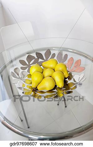 Bowl of artificial pears on a dining table View Large Photo Image Stock Photo - Bowl of artificial pears on a dining table. Fotosearch
