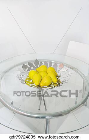 Bowl of artificial pears on a dining table View Large Photo Image Stock Photography - Bowl of artificial pears on a dining table. Fotosearch