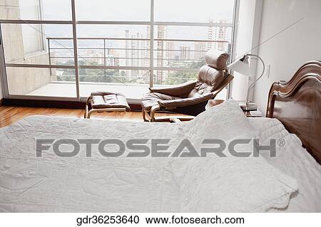 Stock Image - Buildings viewed from the window of a bedroom. Fotosearch